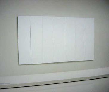 stretched canvases covered by a thin film of white paint.