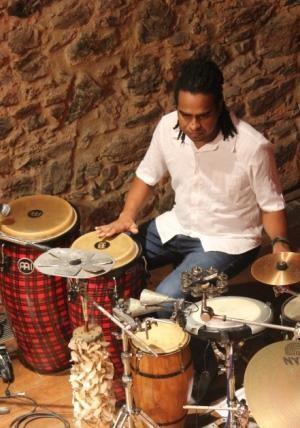 Jair Rocha- drummer and composer has recorded, performed and toured throughout Brazil with Brazilian groups including Carla Visi, Reggae Vibes Collective, Pega no Compasso, Parangolé, Jau, Cabeça de