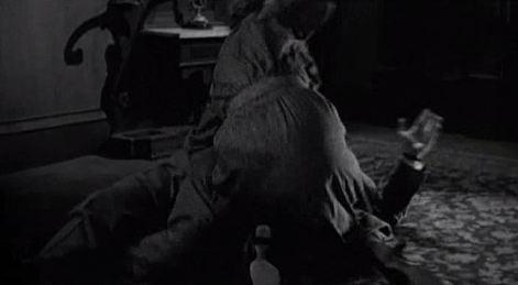 drama of the murder. The rear projection conveys shallow space, making Arbogast look crushed against the floor and creating a claustrophobic feeling.