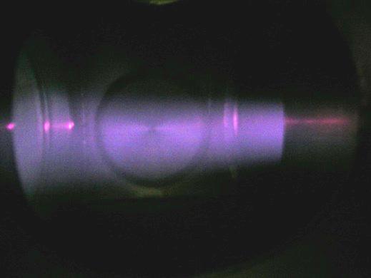 (Right) Beam extracted from the source in September 2006 photographed through diagnostic box viewport. 4.3.