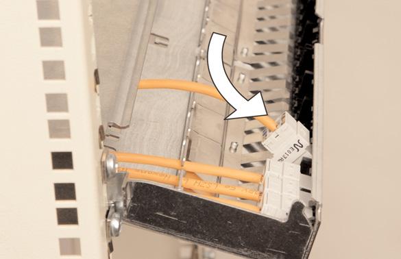 by hooking the top of the connector under the front plate