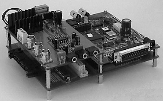 Fig 1 In this picture we can see the two expansion boards developed for DSKC31 The digital expansion board is at the bottom and the analog expansion board on the top left two main goals: simplify the