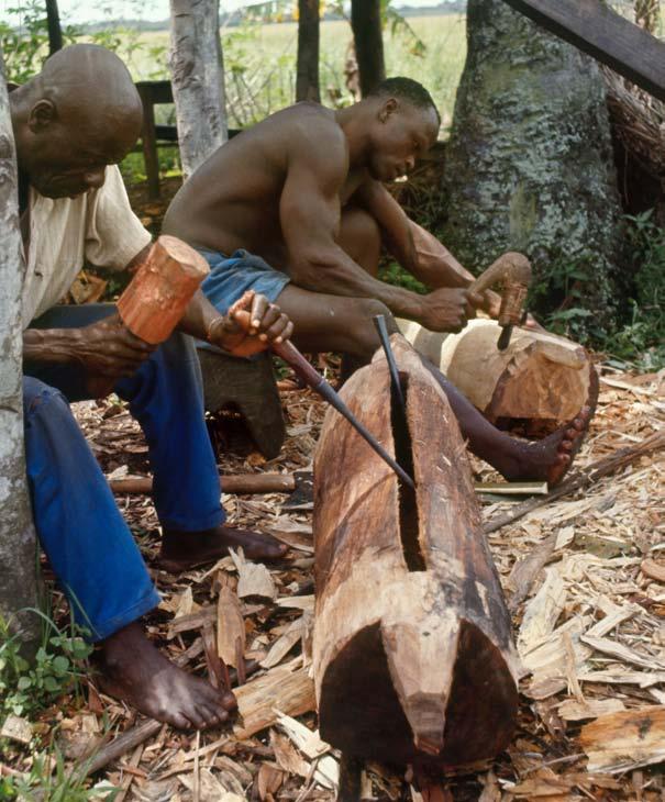 Making an African log drum Knocking on a tree drum on a South Pacific island 11 12