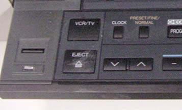 VCR is controlled by the Program volume control on the right side of the control panel When you select as the source for a projector, the display changes to the controls for the VCR.