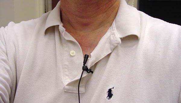 The wireless lavalier microphone should be placed high on your collar or lapel.