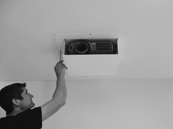Otherwise place projector onto projector housing and place tray above.
