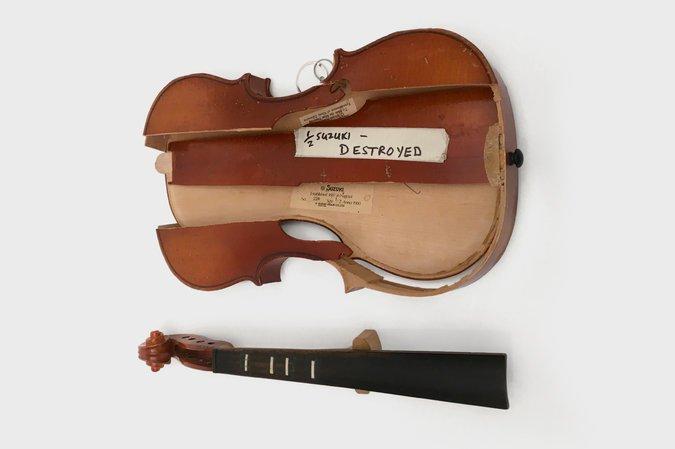 This violin, from the Samuel Gompers Elementary School in Philadelphia, is in pieces, and the face has been smashed.
