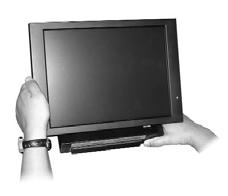 To lift the screen put one hand on the back of the base and the other hand one the LCD and pull forward (see Figure 2-3).