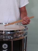ight Hand Position: The right hand should be rotated slightly outward in relation to the drum, (The hand should not be comletely lat to the drum [German gri], nor rotated comletely