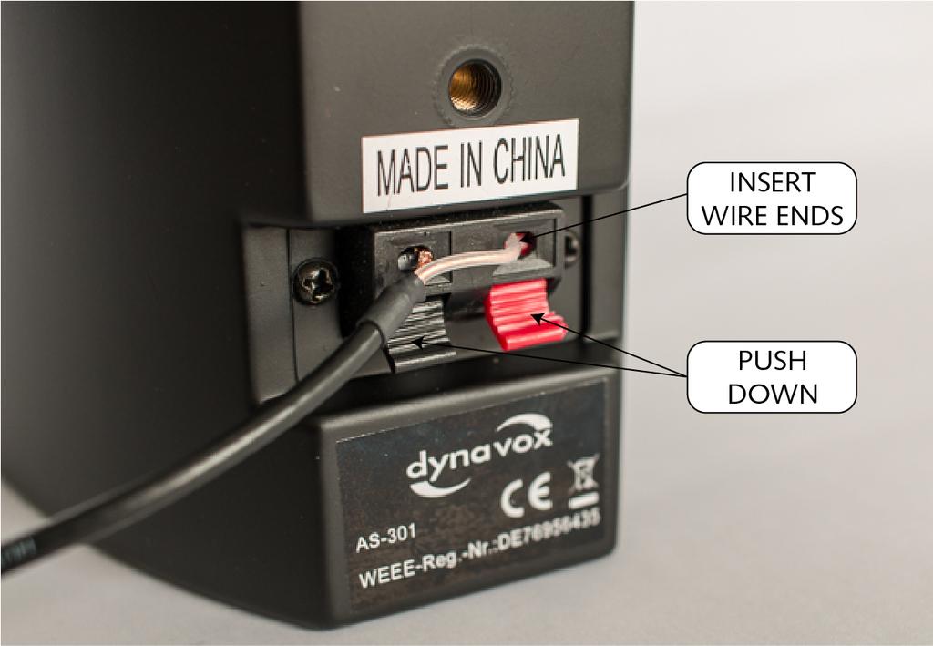 The insulated wire is inserted into the red input, and the braided wire into the black input.