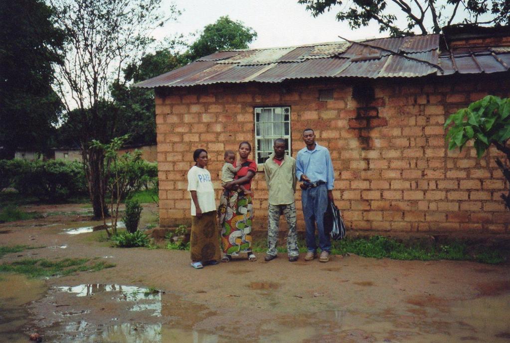 Photo 73: Mrs. N'guza with baby, N guza s brother, Antoine Mukunga, and his cousin s wife on very left 129 Mr.