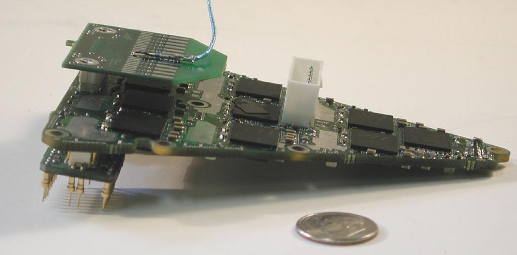 Figure 4 The photograph above shows a module 1 barrel board with a protection input board attached in one location at the bottom of the board and the data cable connector board (unstuffed) attached