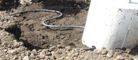 Provide two feet of slack cable in an S pattern (within the width of the foundation) before cable enters the light foundation.