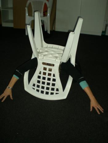 The use of multimodal art representation enables access to parts of the self that can otherwise remain locked away. I use a chair to enact a movement as a multimodal representation of my experience.