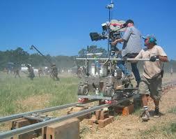 DOLLY GRIP Dedicated technician trained to operate the camera dolly Places, levels, and moves the