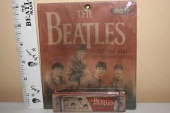 Advertisement for Hohner Harmonica with photo of Beatles
