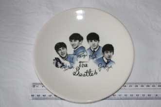 Beatles plate with large photos of Beatle's heads in