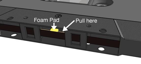 Access the tape from the location immediately beside the foam pad.
