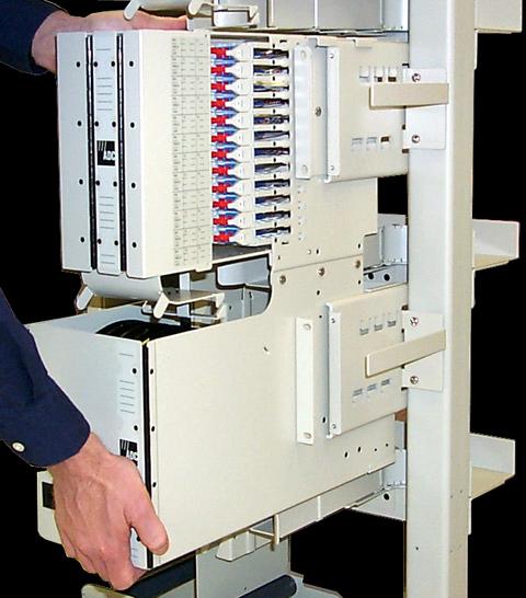 Align the guides on the top of the FCB with the top of the rack mounting bracket as shown in Figure 7.