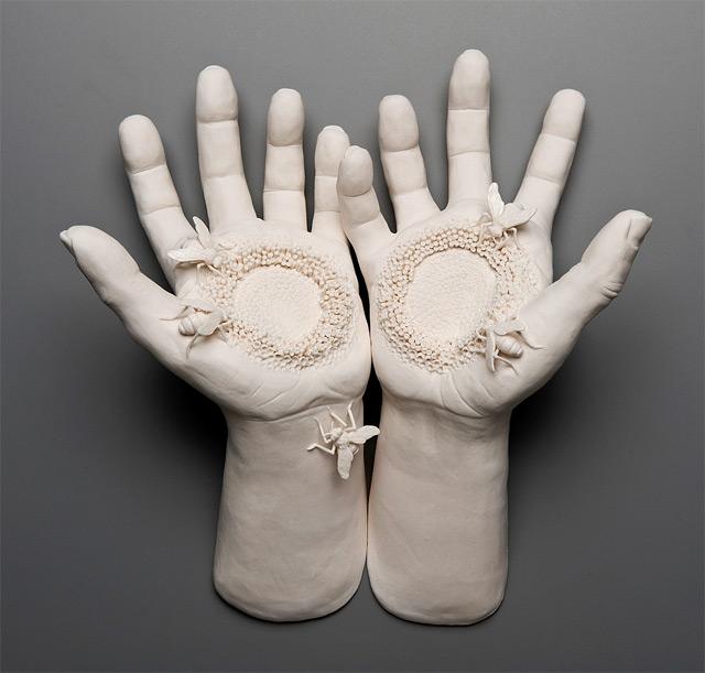 Two examples of her work are given below: one portrays birds roosting inside a pair of human lungs (as opposed to trees); the other shows bees pollinating human hands (as opposed to flowers).