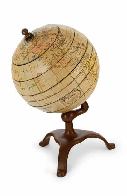 28 29 28 JIG-SAW GLOBE. Terrestrial Globe. New York: Geographic Educator, 1927. A 6 inch (15.11 cm) diameter, 9¾ inch high educational jig-saw terrestrial globe on cast iron tripod stand.