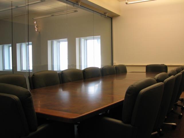 Easy access to stairs and elevators make this a quick meeting point. Large dry-erase wall on one side.