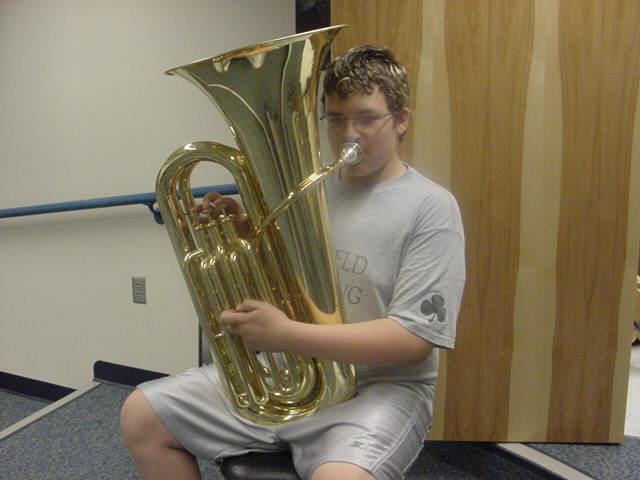 This is a TUBA. It is the largest and lowest of the brass instruments. It is like a Euphonium, only slightly larger. It provides bass for the band.