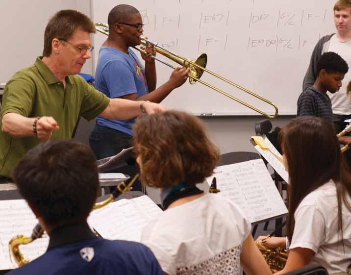 JB Dyas (left) works with the big band at Houston s High School for the Performing and Visual Arts. Jazzing up Jazz Band By JB Dyas, Ph.D. Presenting jazz workshops across the country on behalf of