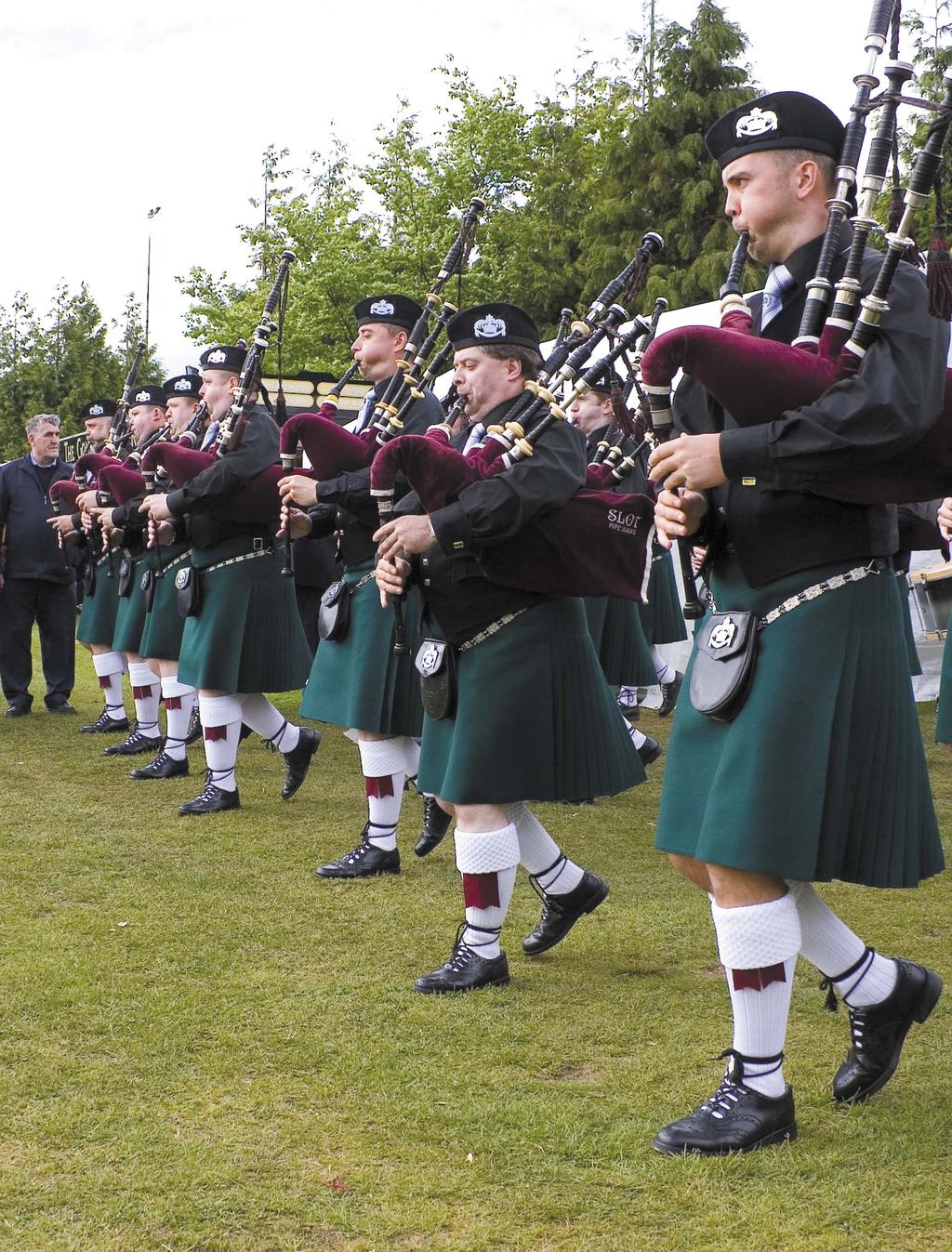 The front rank of St Laurence O Toole Pipe Band marching out of fi nal tuning at the Scottish Championships at Dumbarton this year.