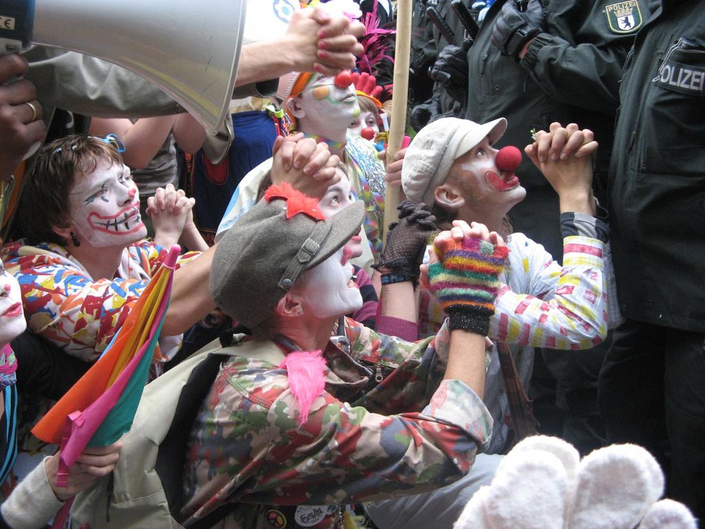 This gives the movement a comical atmosphere and serve to maintain anonymity during protests, instead of guns, the group uses water pistols and feather dusters, then finally, clown make-up, creating