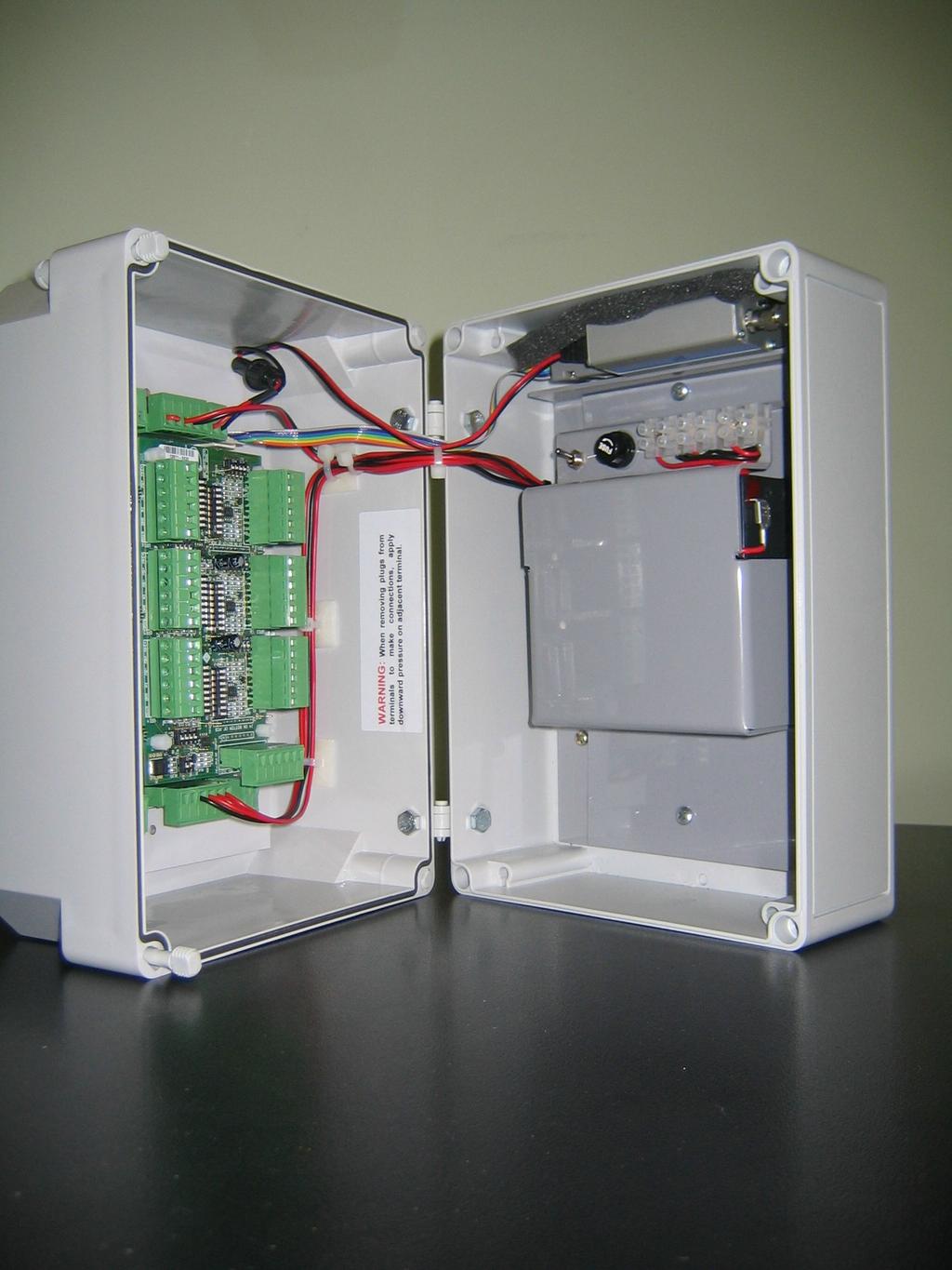 DM Construction Enclosure is suitable for outdoors and is IP65 rated It has a hinged lid. The electronics circuit is mounted in the lid for easy access to the terminals.