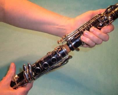 Begin by sitting in a chair and setting the case on the floor. It can be difficult to balance it on your lap and put your clarinet together at the same time.