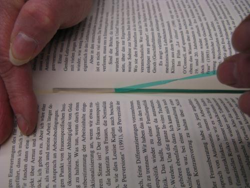 Allow the adhesive to stick to the page, but make sure that no printed information is