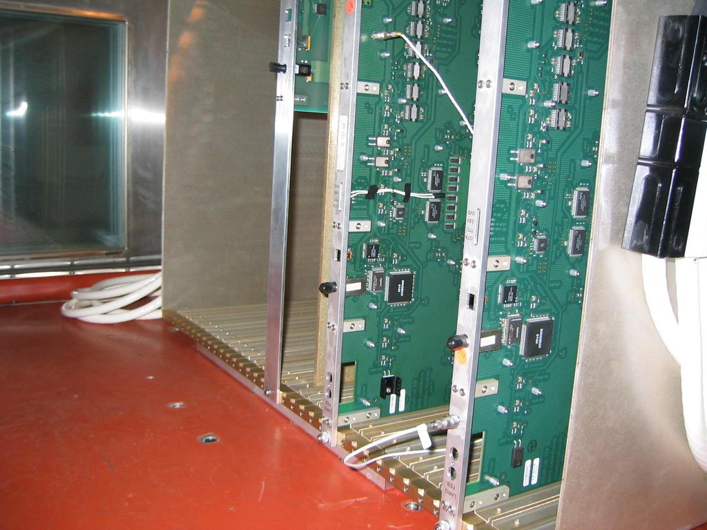 Figure 7: Image of the two front end boards used in the HASS initial tests with accelerometers glued to the boards (on the lower part of the front panel for the right-hand board, on the PCB for the