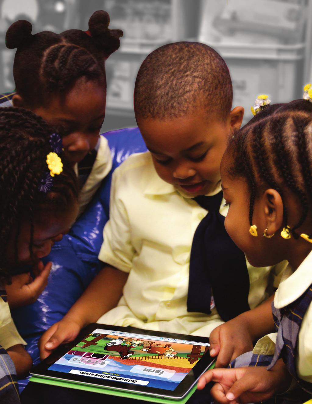 Pre-Kindergarten students gather around a tablet to learn keywords