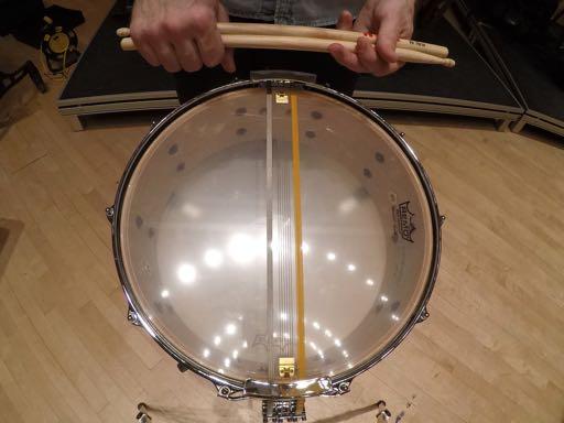 The drum should also be setup so that the snares on the underside of the drum follow this same straight line, as shown here.