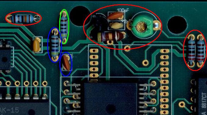 Solder a 10.7386MHz crystal HC49/S (low profile) in the place of the resistor marked with the blue ellipse. Place a jumper in the place where the capacitor is marked with the blue ellipse.
