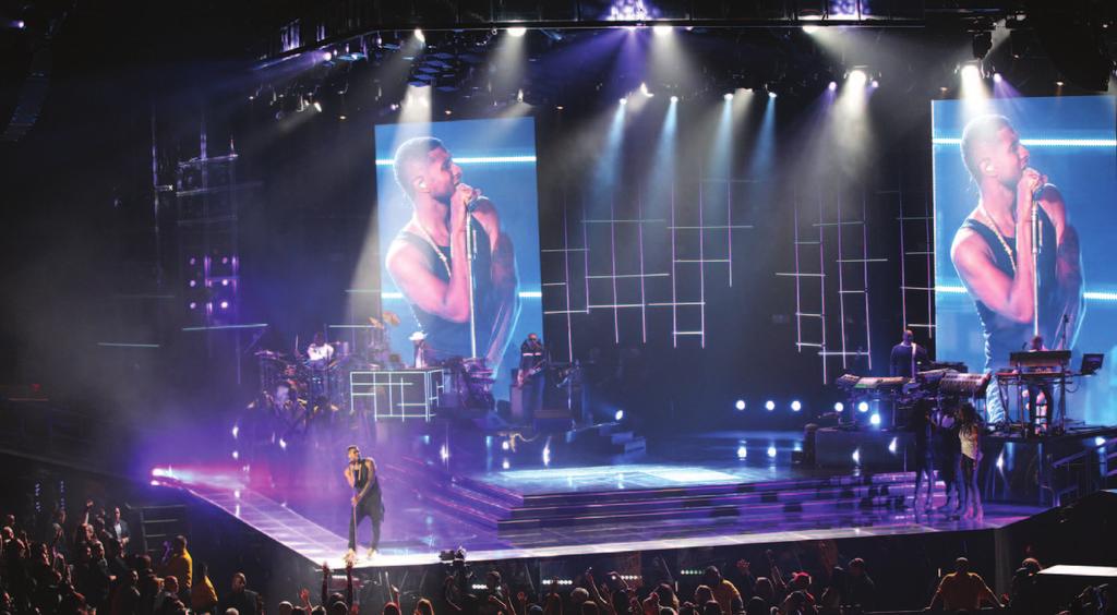 Opposite: The light ladders that flank the video wall are comprised of units from GLP, Solaris, and Elation Professional. Above: The video wall in bi-parted mode, with IMAG of Usher.