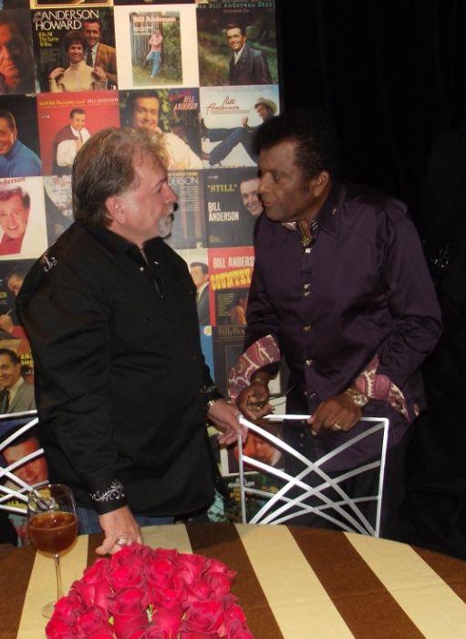 Photo Right: During the TV taping, Gene enjoyed having a moment to talk to one of the greats of country music, Charley Pride.
