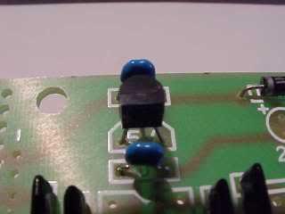Now we fit the little three pin voltage regulator (78L05) which goes into the position marked 5V as shown.
