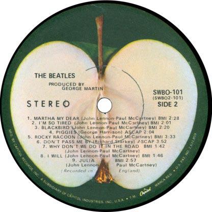 The Beatles Label ac1 Apple label with Capitol logo on the sliced side.