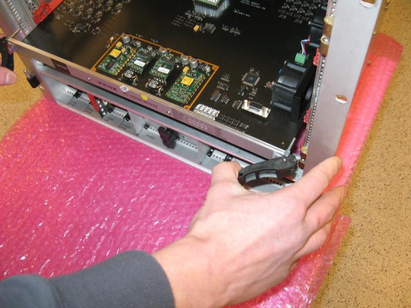 2 Card removal To remove an XC-M256128-3GHD card from the frame, release the card by pushing the