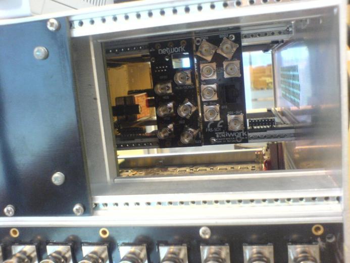 main plus 1 monitor line from its related X-point card and sending 32 signals to both X-point cards. The 32 SMA connectors are located at the upper, left end of the main backplane.