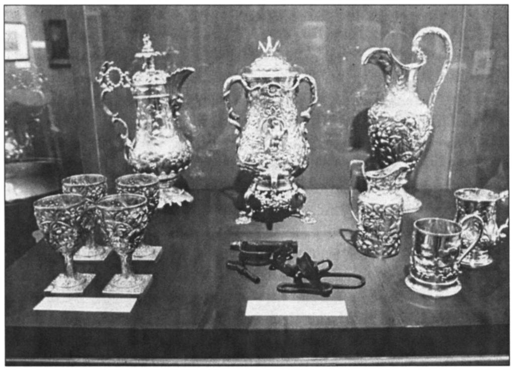 AN INTERVIEW WITH ARTIST FRED WILSON 217 MetalwoHc 1793-1880 (1992) installation by Fred Wilson, featuring silver vessels and slave shackles, from the "Mining the Museum" exhibition at the Baltimore