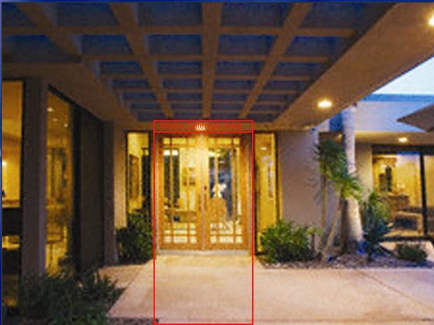 In this example, the Motion Detection Area (red box) has been drawn to avoid foliage that may generate false recordings blowing in the wind. The doorway and walk will still trigger recordings.
