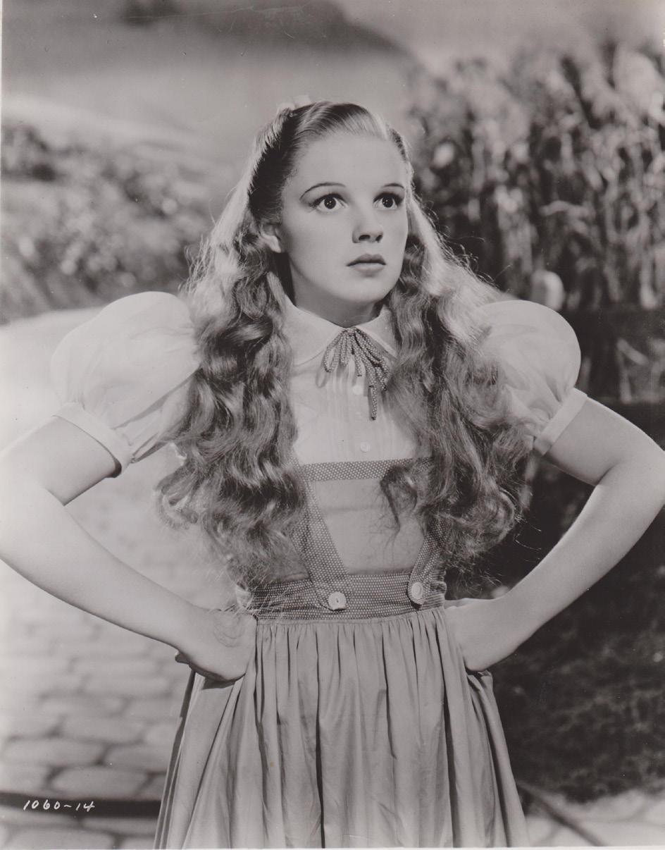 DEVELOPING CHASING RAINBOWS (CONTINUED) Judy Garland during the initial filming of The Wizard of Oz (with a blonde wig and a pink dress!). Courtesy of The John Fricke Collection. articulate.