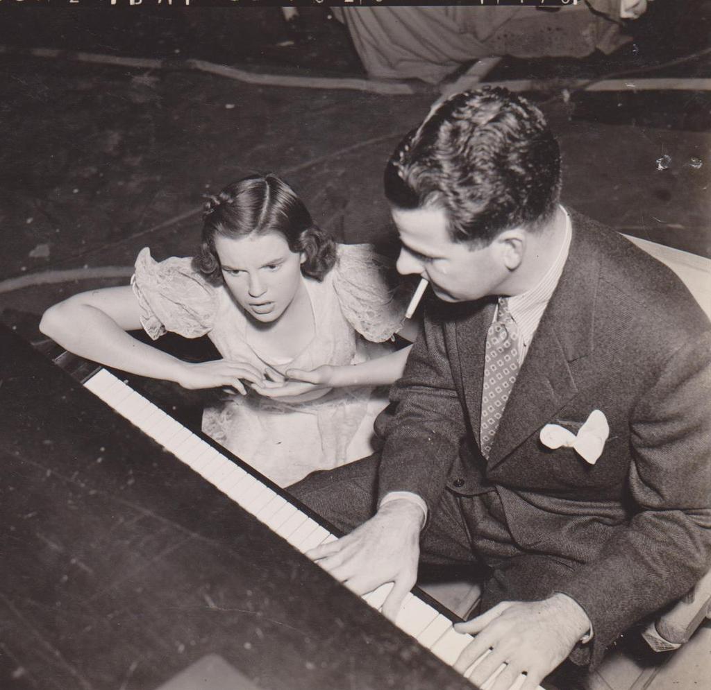 THE REAL CHARACTERS (CONTINUED) Judy Garland and Roger Edens. Courtesy of The John Fricke Collection. Judy Garland and Clark Gable. Courtesy of The John Fricke Collection. ROGER EDENS was at once Judy Garland s vocal coach, composer and arranger, and surrogate father.