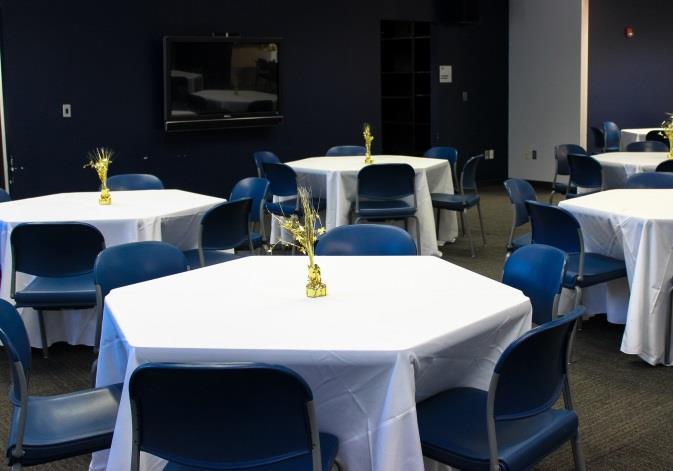 Amenities include tables, chairs, roll-down projection screen, LCD projector, podium, wireless internet access, conference call speakerphone, as well as a back room that can be used for materials