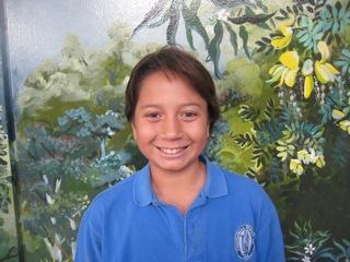 My favorite color is green and I like the movie School of Rock. My name is Aina. I like to surf and play football.