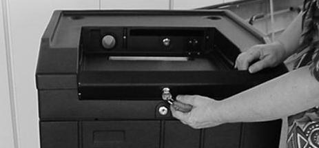 9. UNLOCK the ballot box lid with the blackrimmed key and verify that the ballot box is empty.
